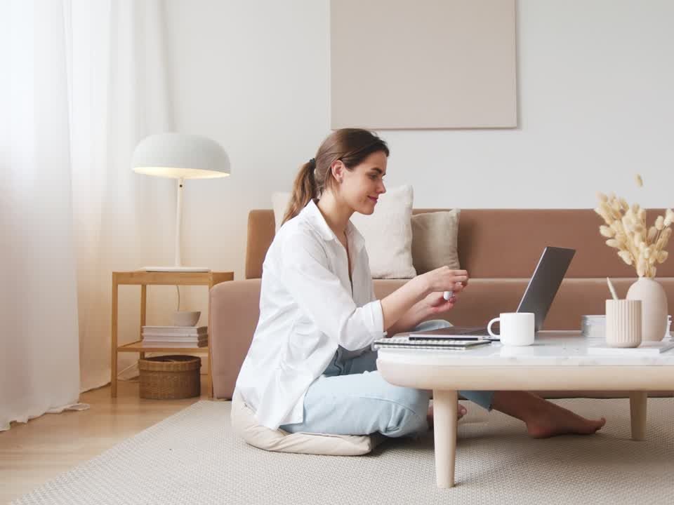 New Zealand job seeker working on her CV and job applications from home